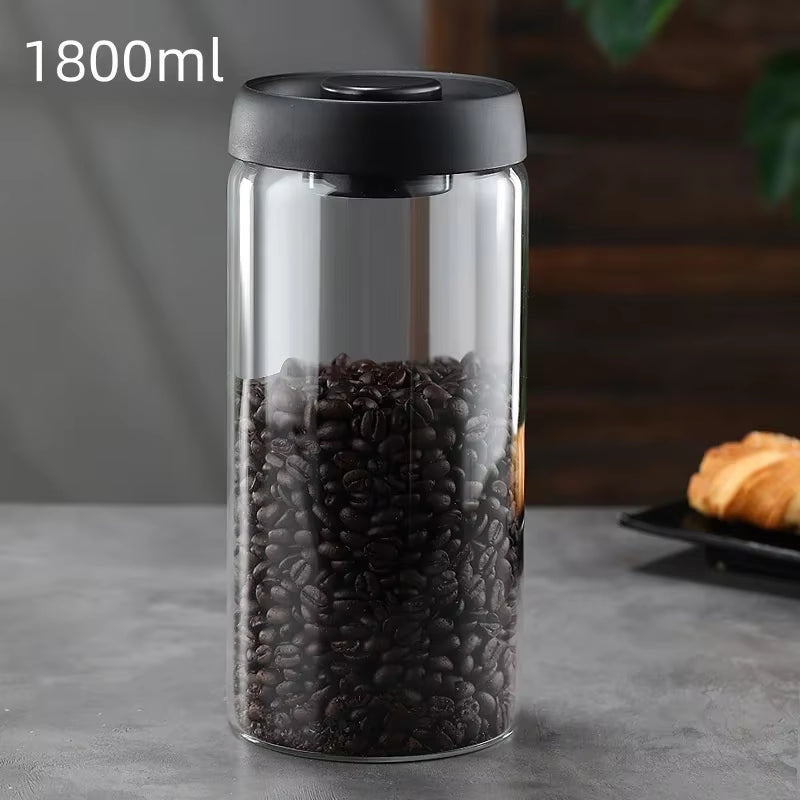 1800 ml borosilicate glass vacuum canister with black lid filled with coffee beans
